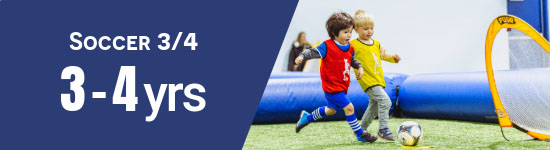 Kids chasing a soccer ball scoring on a net and wearing soccer pinnies. 3-4 years old.